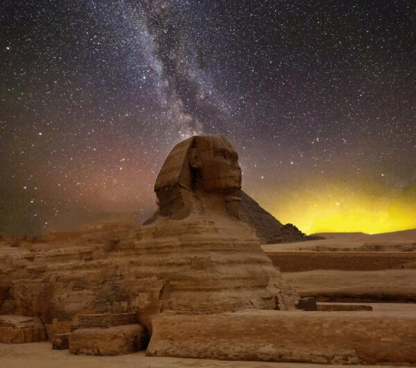 Stunning capture of the Great Sphinx of Giza beneath a star-lit sky with the Milky Way.