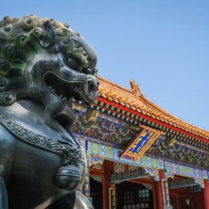 Close view of Foo Dog statue and traditional Chinese architecture at Beijing's Summer Palace.