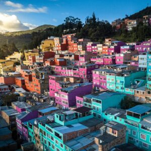 Aerial view of vibrant, colorful houses on a hillside in Bogotá, Colombia.