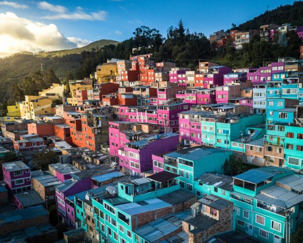 Aerial view of vibrant, colorful houses on a hillside in Bogotá, Colombia.