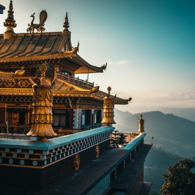 brown and green temple on top of mountain during daytime