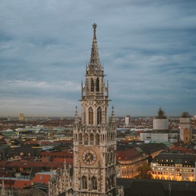 A stunning view of Munich's New Town Hall at dusk showcasing its Gothic architecture.